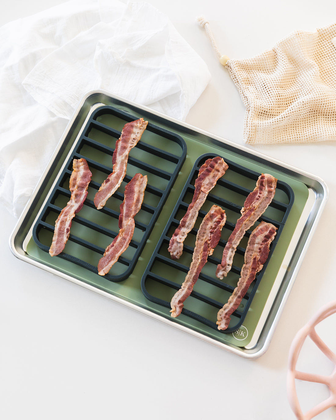 Bacon on silicone baking sheet and silicone roasting racks