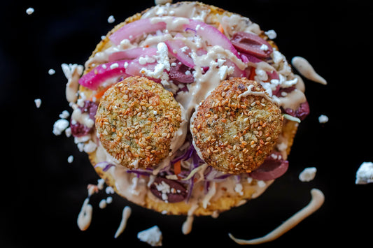 Air Fryer Falafel Tostada on a black background